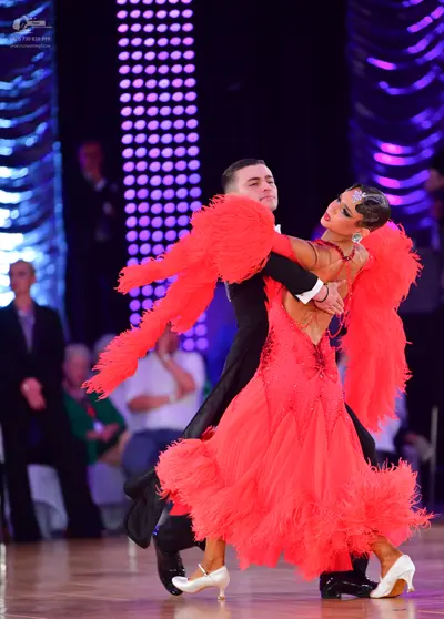 Dancesport competitor: Male dancer: black suit with a white shirt and black shoes