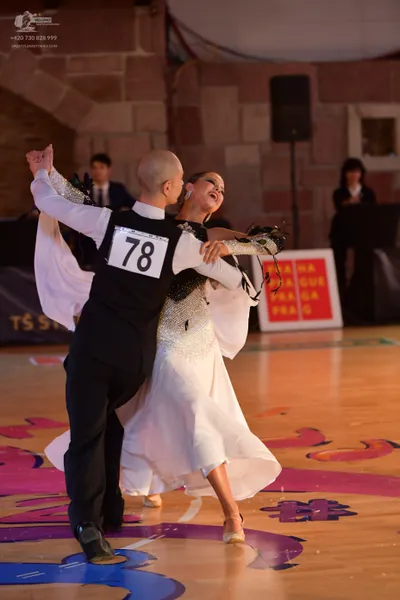 Dancesport competitor #78: Male dancer: black vest, white long-sleeved shirt, and black trousers