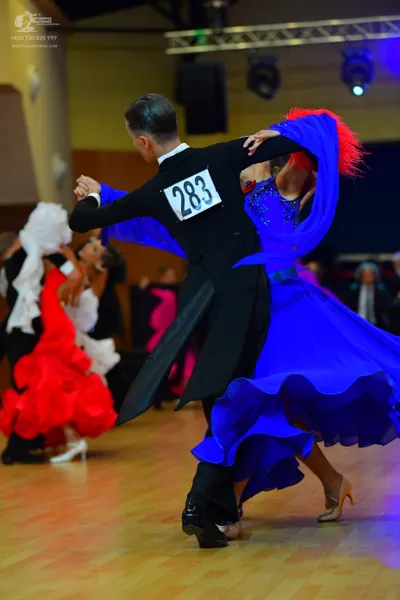Dancesport competitor #283: Male dancer in foreground: black tailcoat suit with white shirt and black trouse