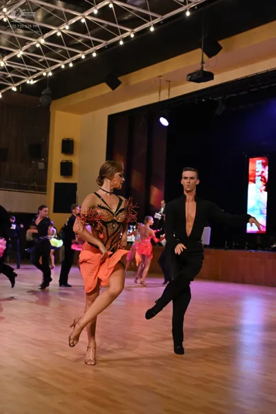 Dancesport competitor: Male dancer: black latin dance shirt and trousers