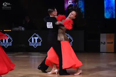 Dancesport competitor: Male dancer: black long-sleeved shirt and black trousers