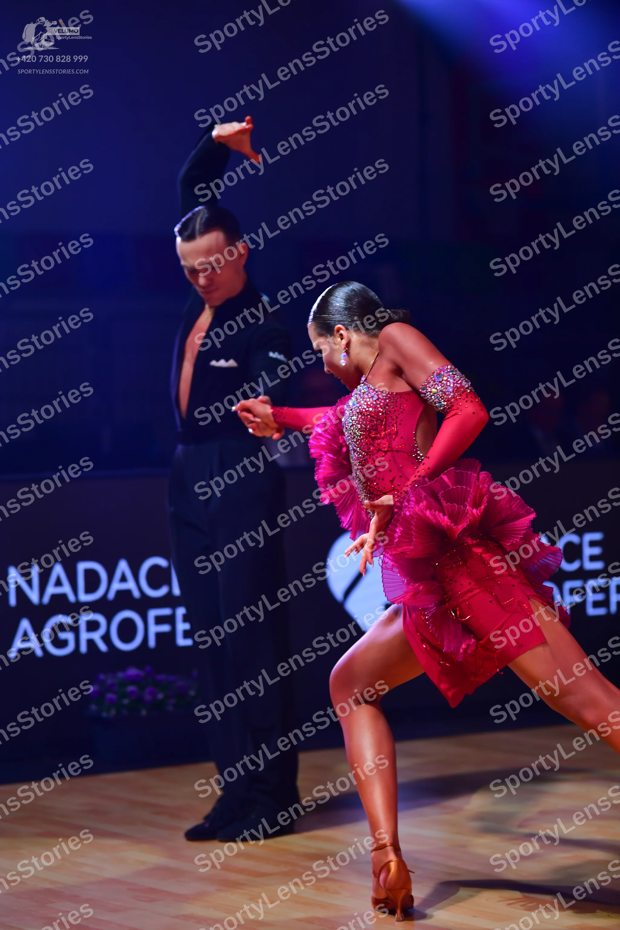 Dancesport competitor: Male dancer: black long-sleeved dance shirt and black trousers