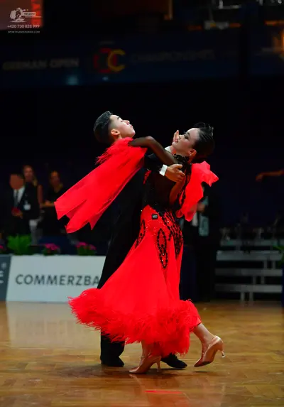 Dancesport competitor: Male dancer: black suit