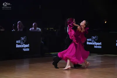 Dancesport competitor: Male dancer: black suit with a white shirt