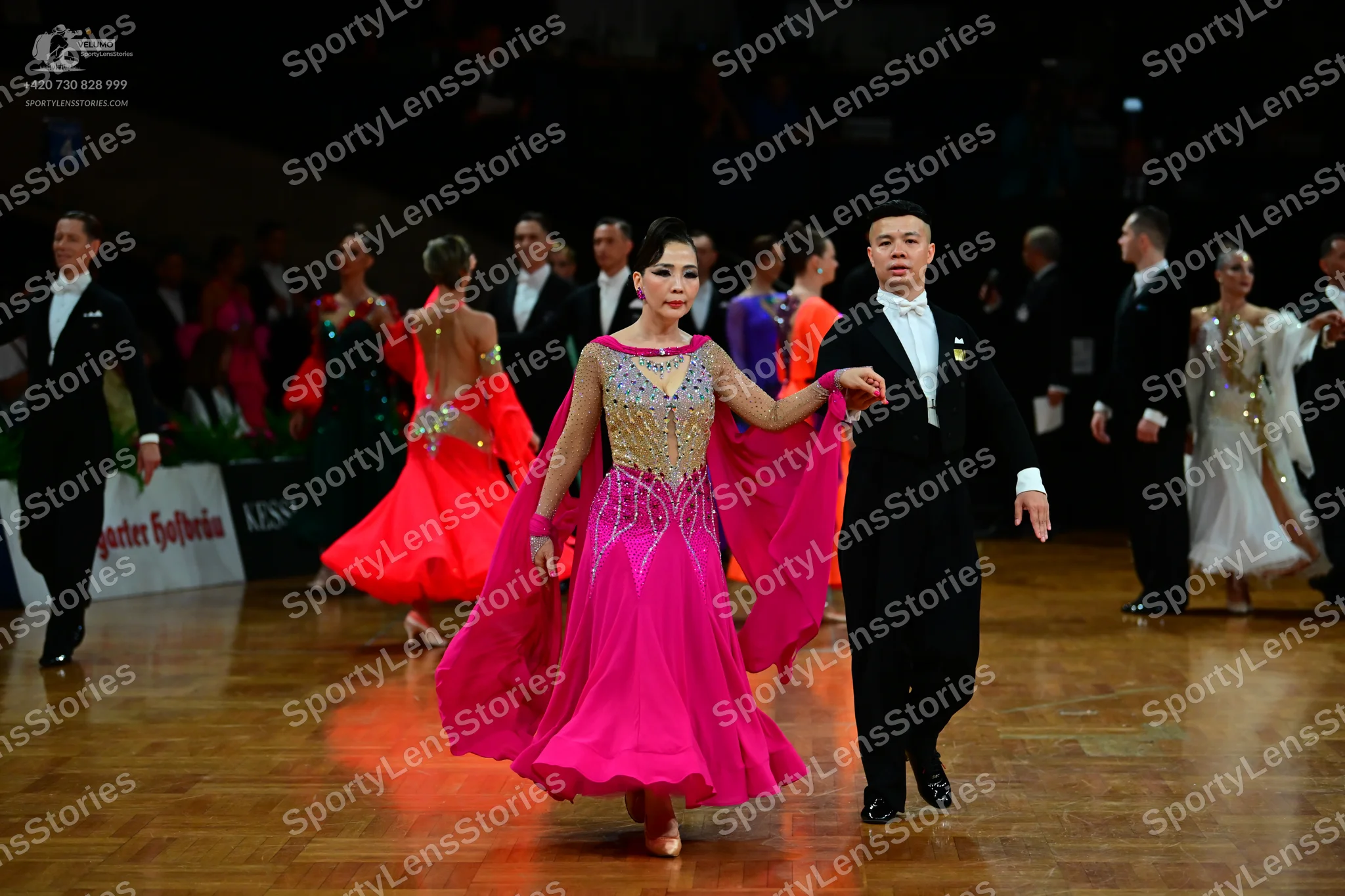 Dancesport competitor: Male dancer: black suit, white shirt, and black tie
