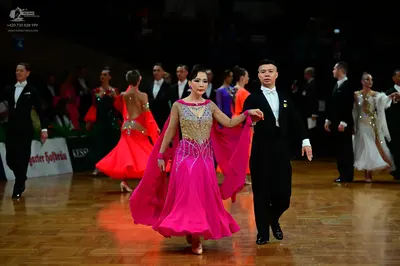 Dancesport competitor: Male dancer: black suit, white shirt, and black tie