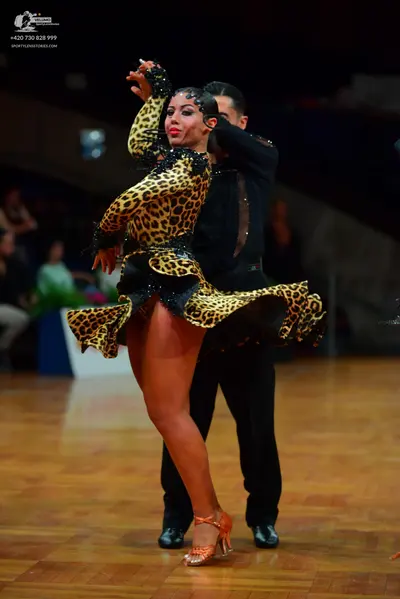 Dancesport competitor: Male dancer: black long-sleeved shirt and black trousers
