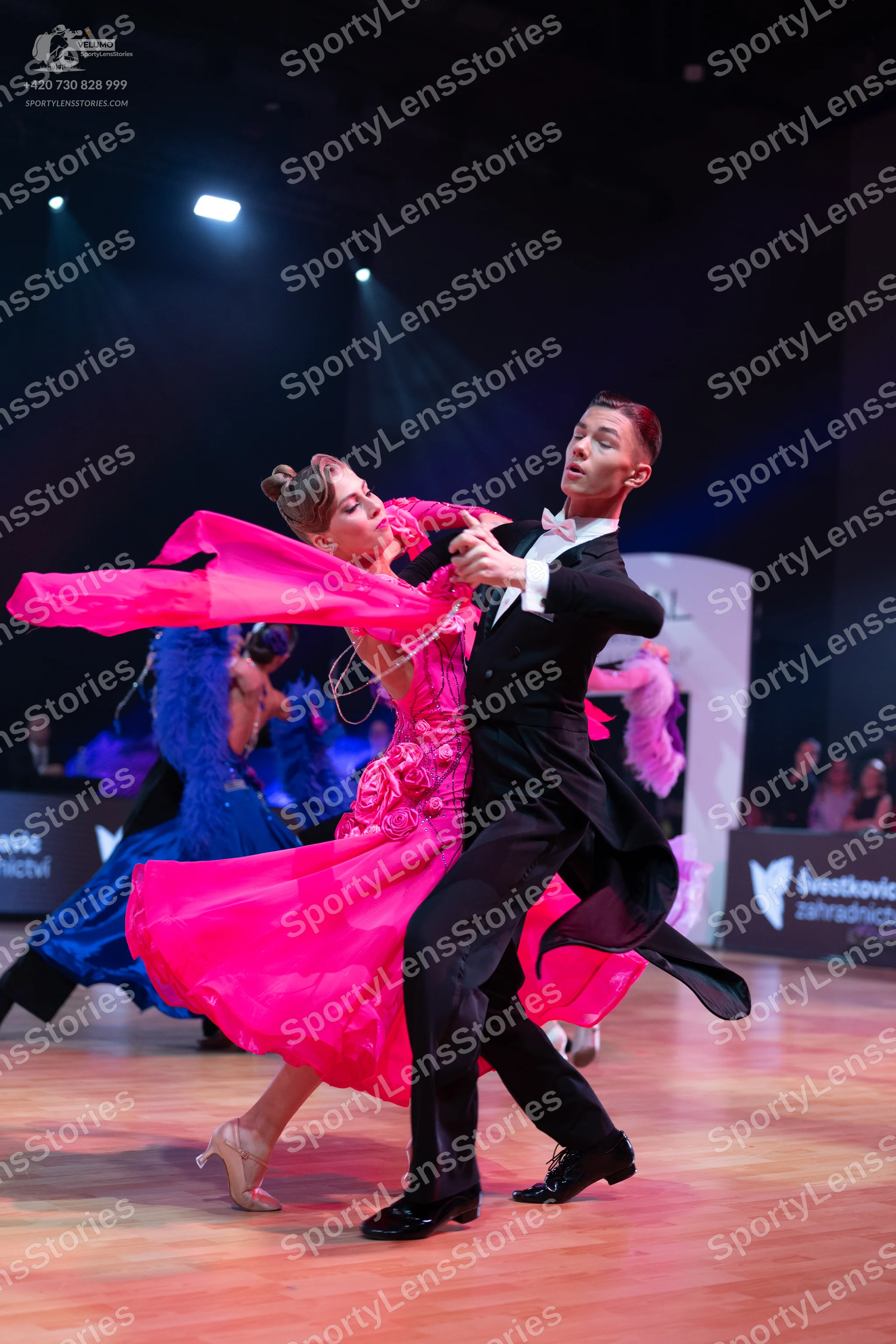 Dancesport competitor: Male dancer: black suit, white shirt, white bow tie, and black trousers
