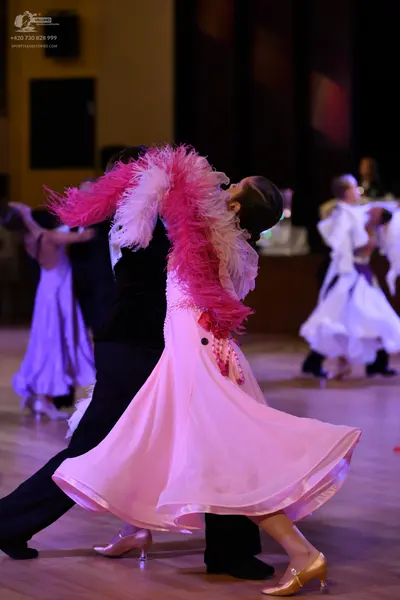 Dancesport competitor: **  Pink ballgown style dress