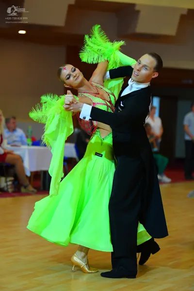 Dancesport competitor: Male dancer: black tailcoat, white shirt, and black trousers