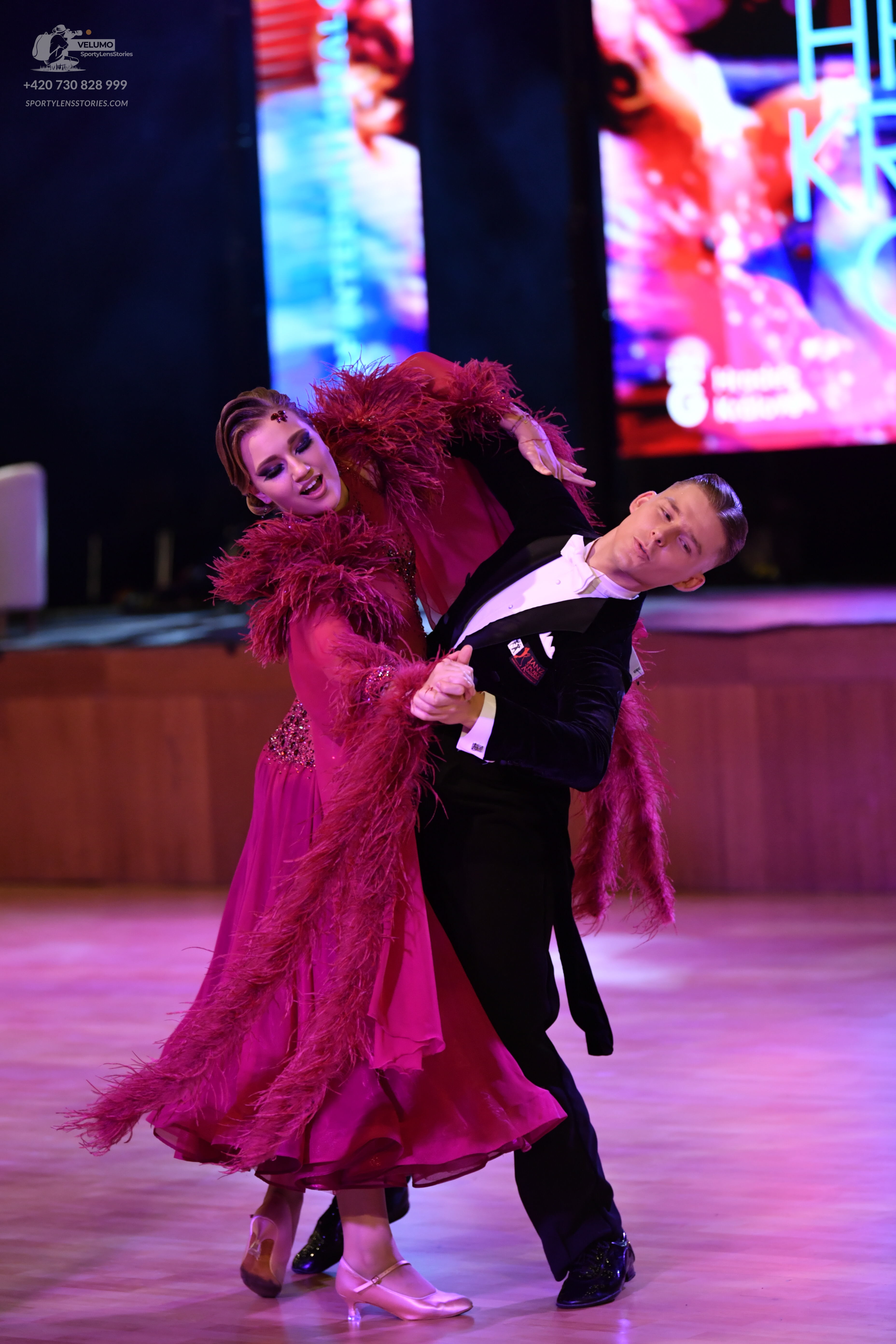 Dancesport competitor: Male dancer: black suit with a white shirt and white pocket square