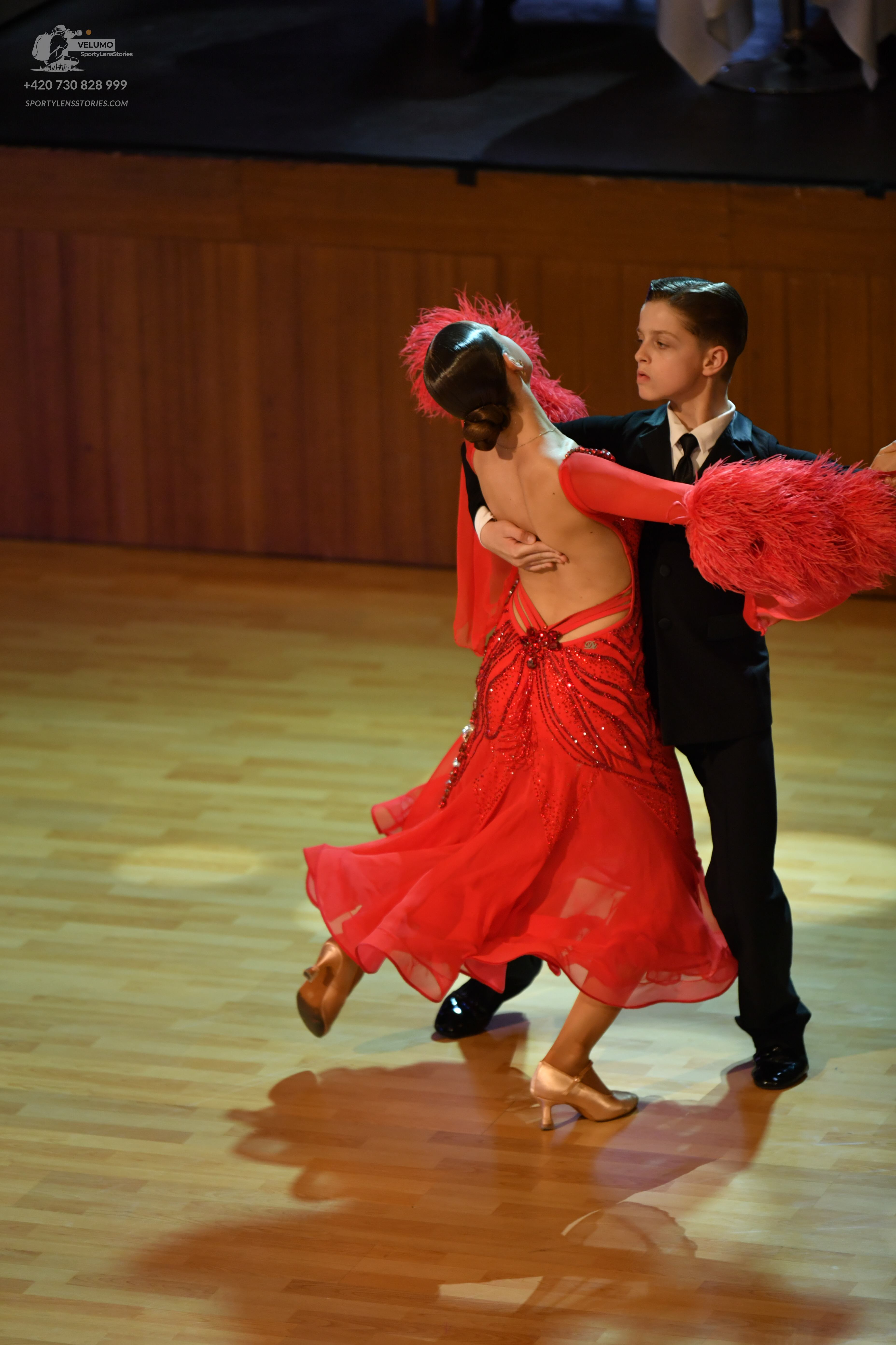 Dancesport competitor: ** Black tailsuit
*   **Fabric:** Satin (likely with a subtle sheen)
*   **Style