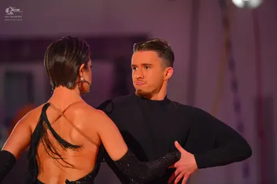 Dancesport competitor: Male dancer: black long-sleeved, high-neck shirt