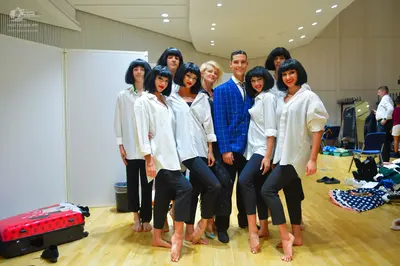Dancesport competitor: Female dancers: white long-sleeved button-down shirts and black slim-fitting pan