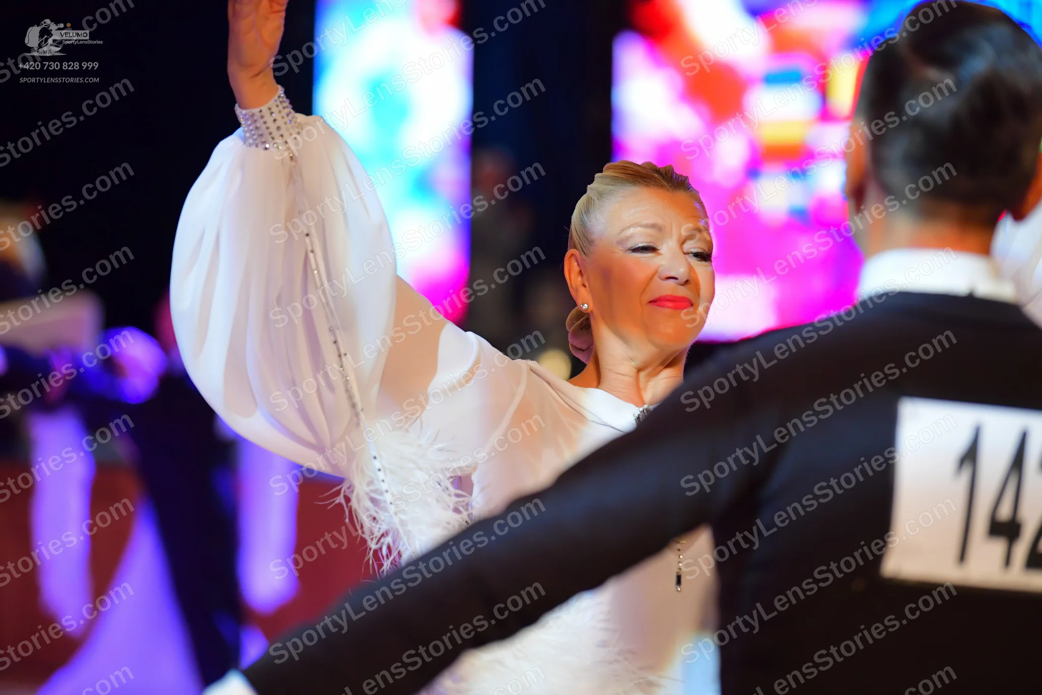 Dancesport competitor #14: Male:** Black tailsuit with sequin lapels
