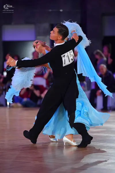 Dancesport competitor #713: Male dancer: black long-sleeved top and black trousers