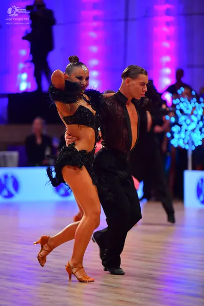 Dancesport competitor: Male dancer: black latin dance shirt and trousers