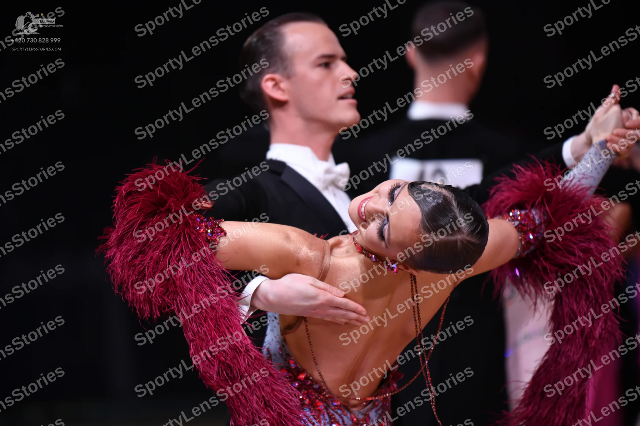 Dancesport competitor: Male dancer: black suit with a white shirt and white bow tie