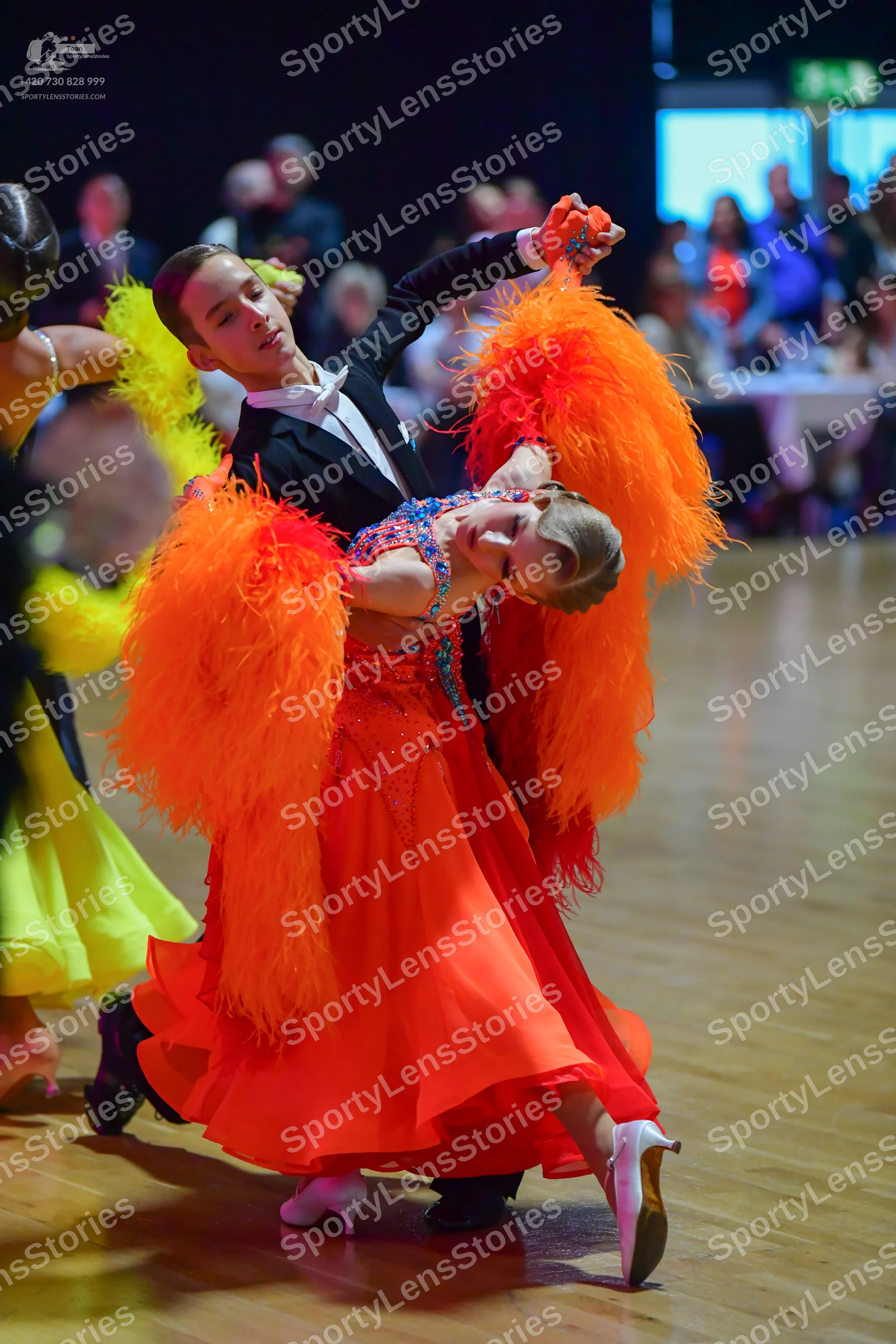 Dancesport competitor: Male dancer: black suit with a white shirt