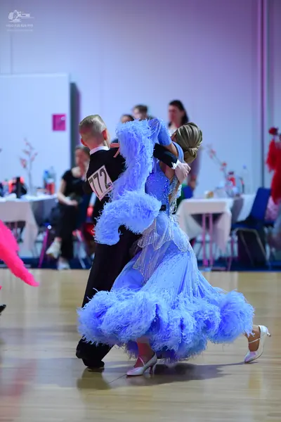Dancesport competitor #772: Male dancer: black suit with a white shirt