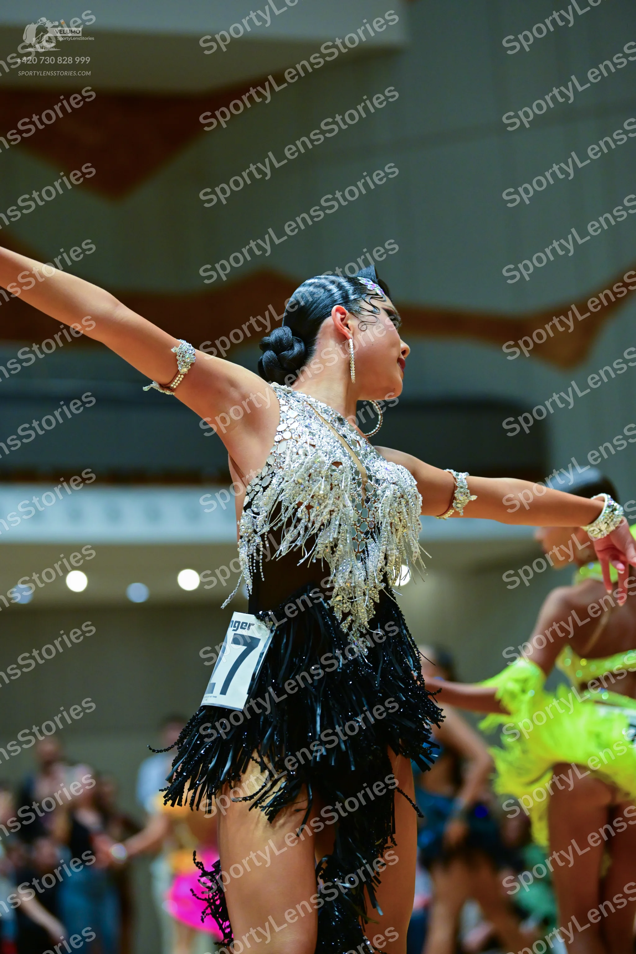 Dancesport competitor #27: Female dancer in foreground: black and silver latin dress with silver sequins/cr