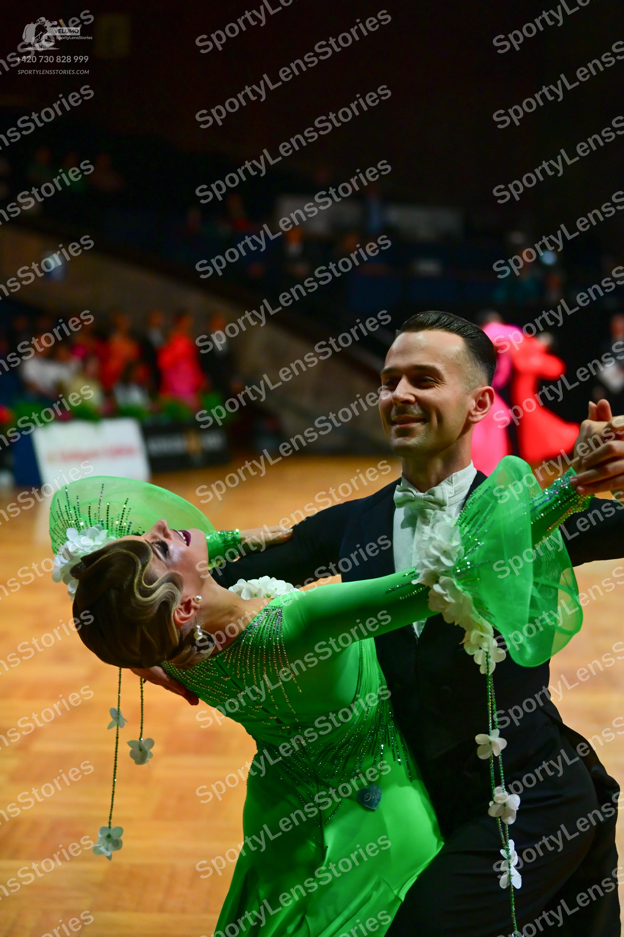 Dancesport competitor: Male dancer: black suit with a white shirt and white bow tie