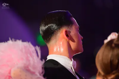 Dancesport competitor: Male dancer: black suit with a white shirt