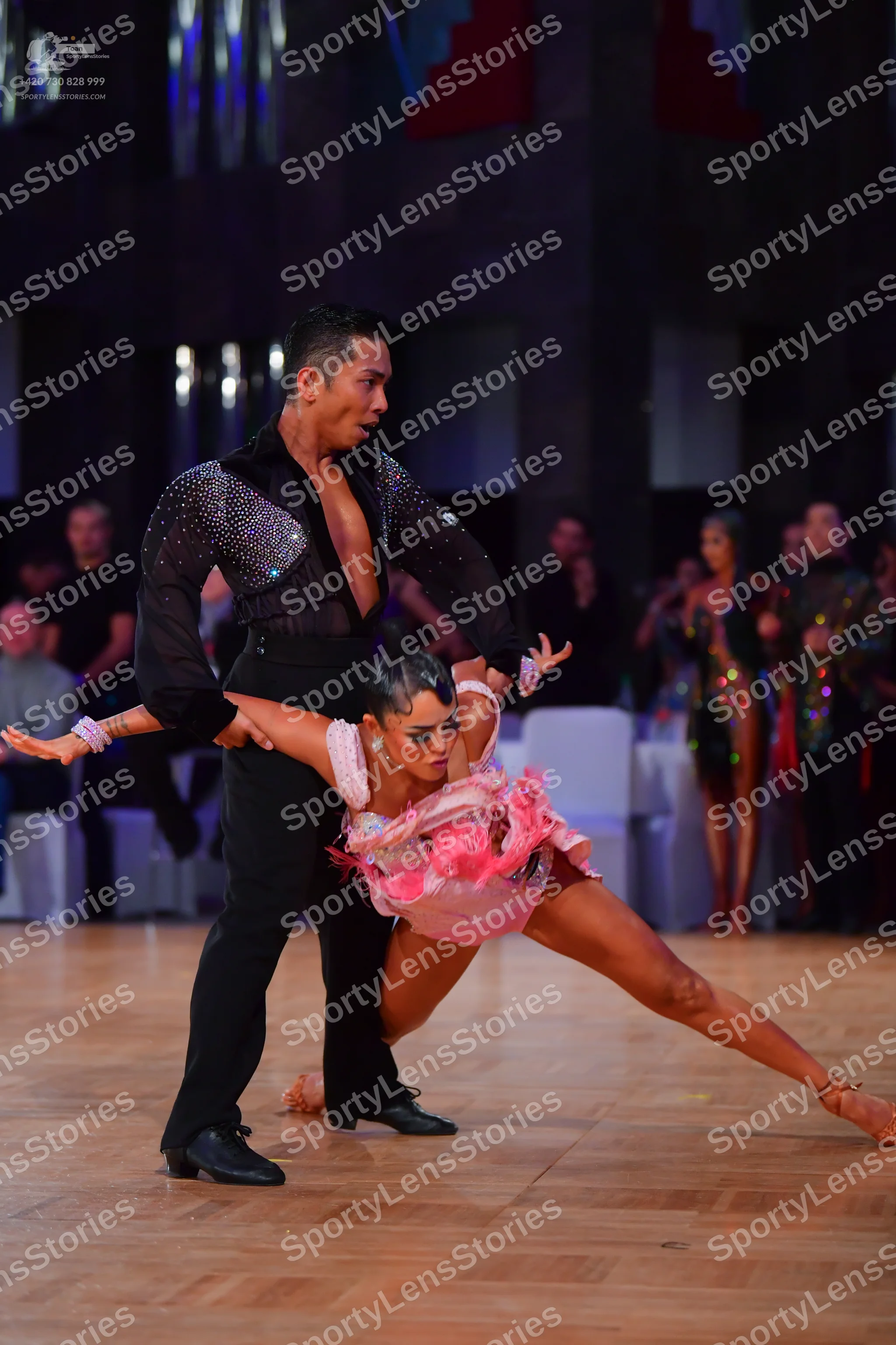 Dancesport competitor: Male dancer: black long-sleeved Latin dance shirt with sequins on the upper ches