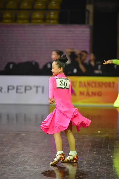 Dancesport competitor #86: Female dancer: bright pink latin dress