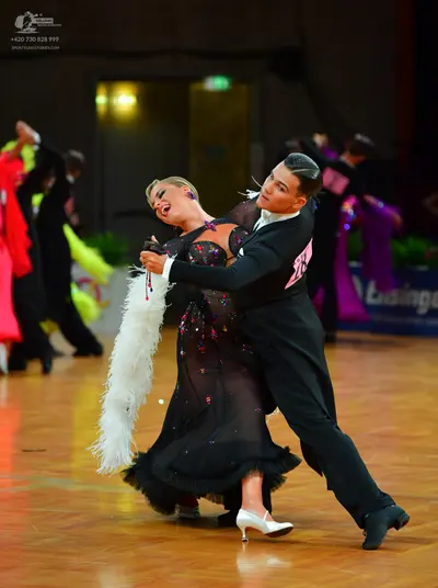 Dancesport competitor: Male dancer: black suit