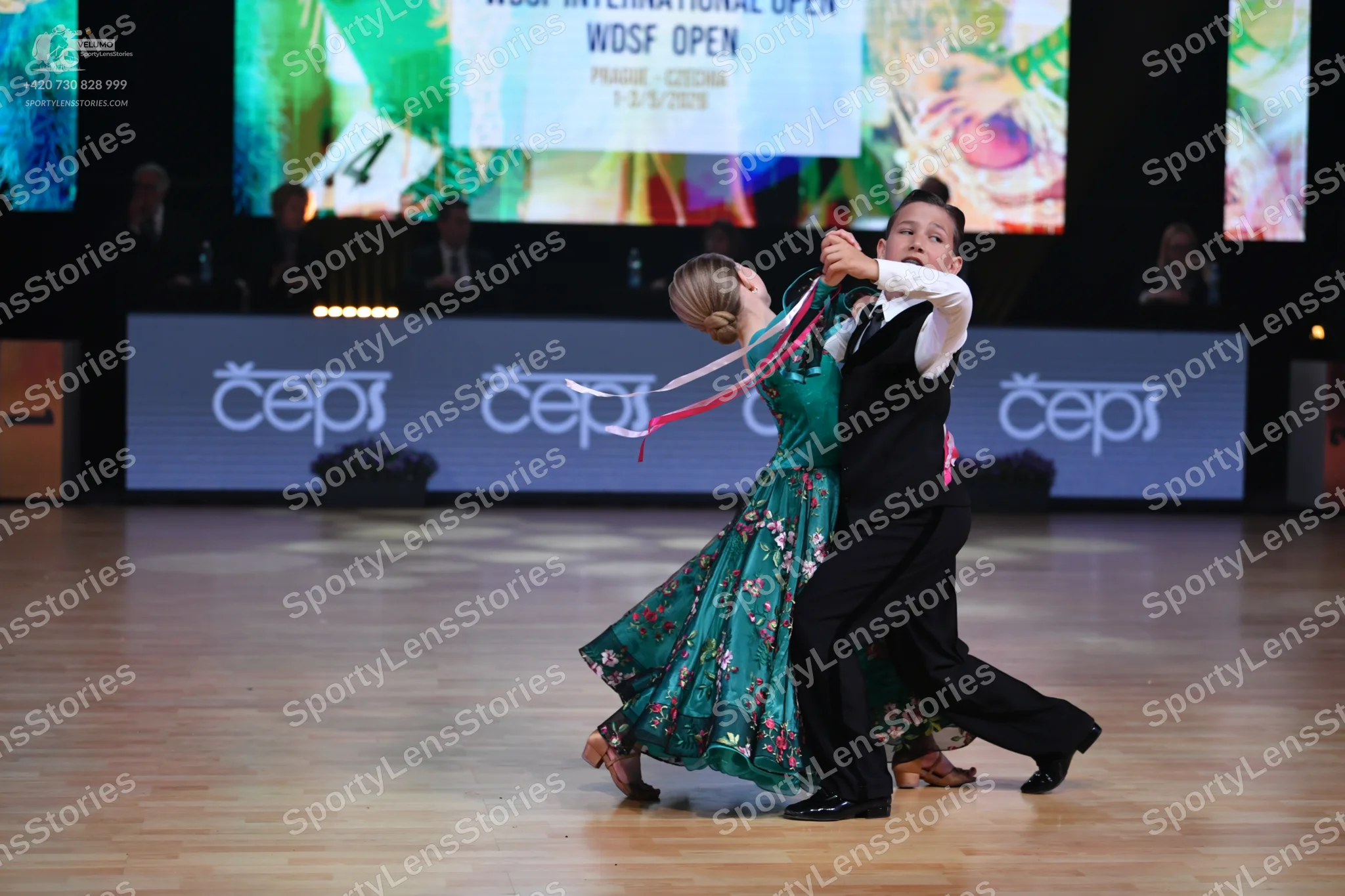 Dancesport competitor: Male dancer: black waistcoat, white long-sleeved shirt, and black trousers