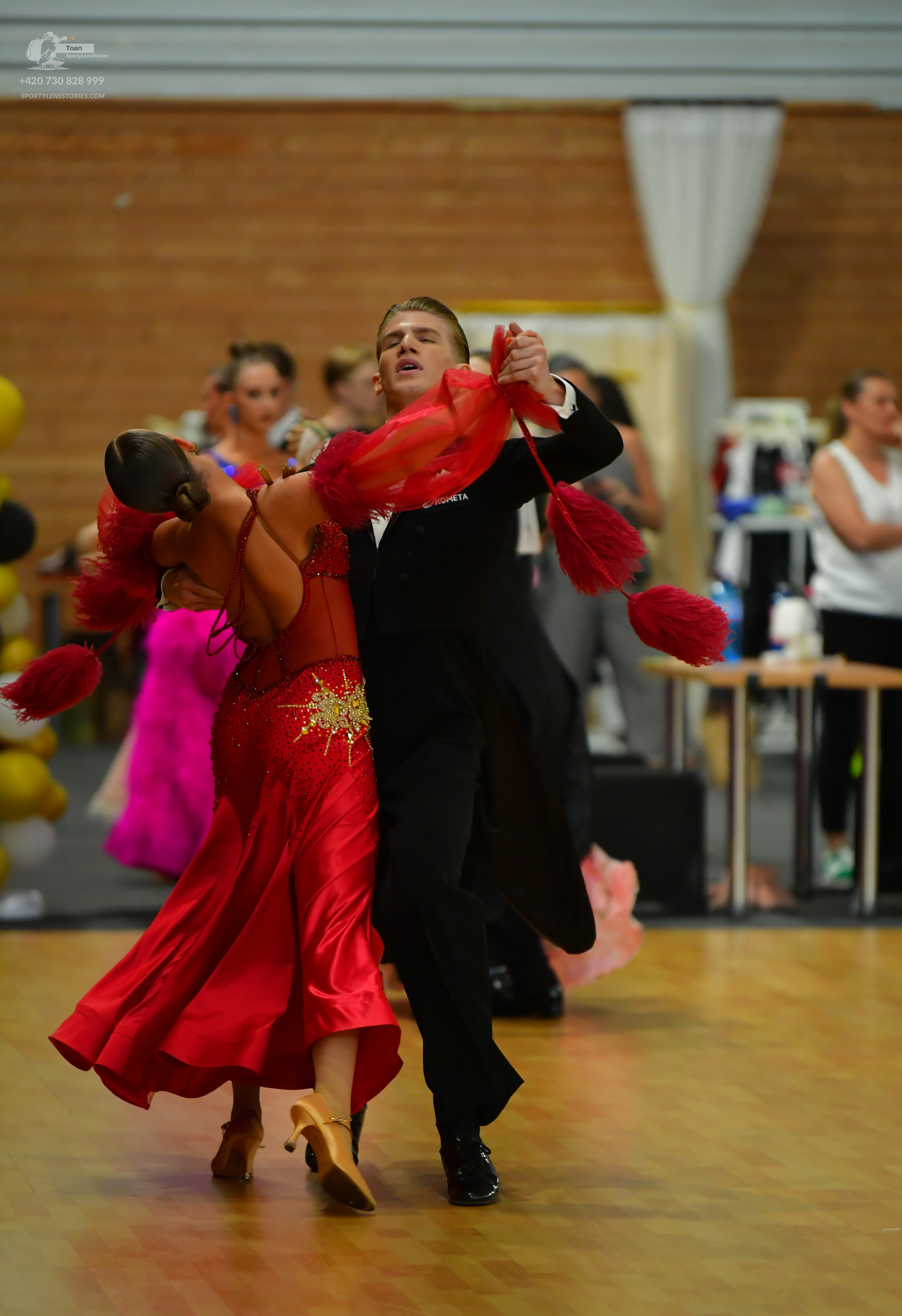 Dancesport competitor: ** Red Latin Dress - The dress is a full, flowing Latin style with a fitted bodi