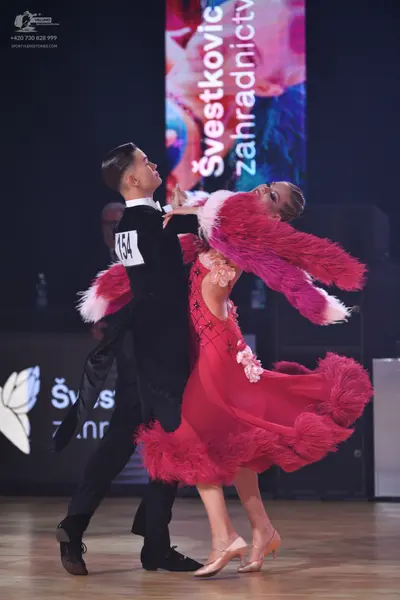 Dancesport competitor: Male dancer: black suit