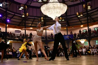 Dancesport competitor: Male dancer: white long-sleeve shirt and black trousers
