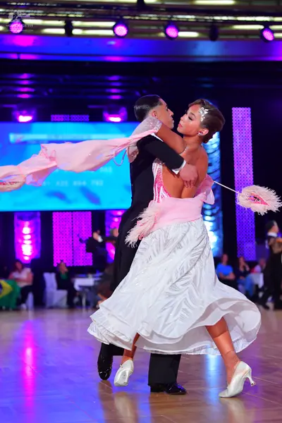 Dancesport competitor: Male dancer: black suit