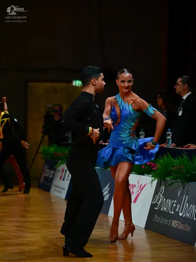Dancesport competitor: Male dancer: black long-sleeved shirt and black trousers