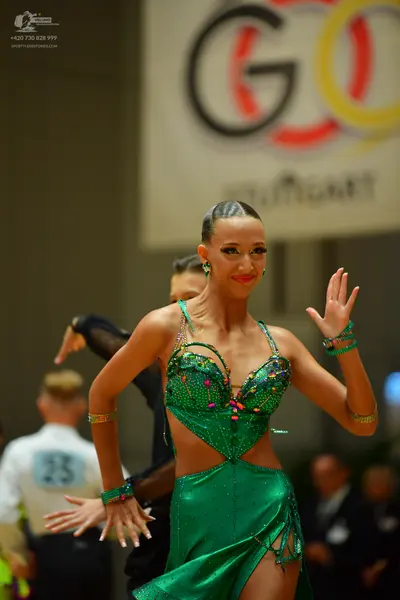 Dancesport competitor #25: Female dancer: green latin dress with sequins and fringe