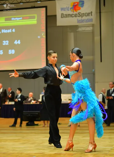 Dancesport competitor: Male dancer: black long-sleeved shirt and black trousers