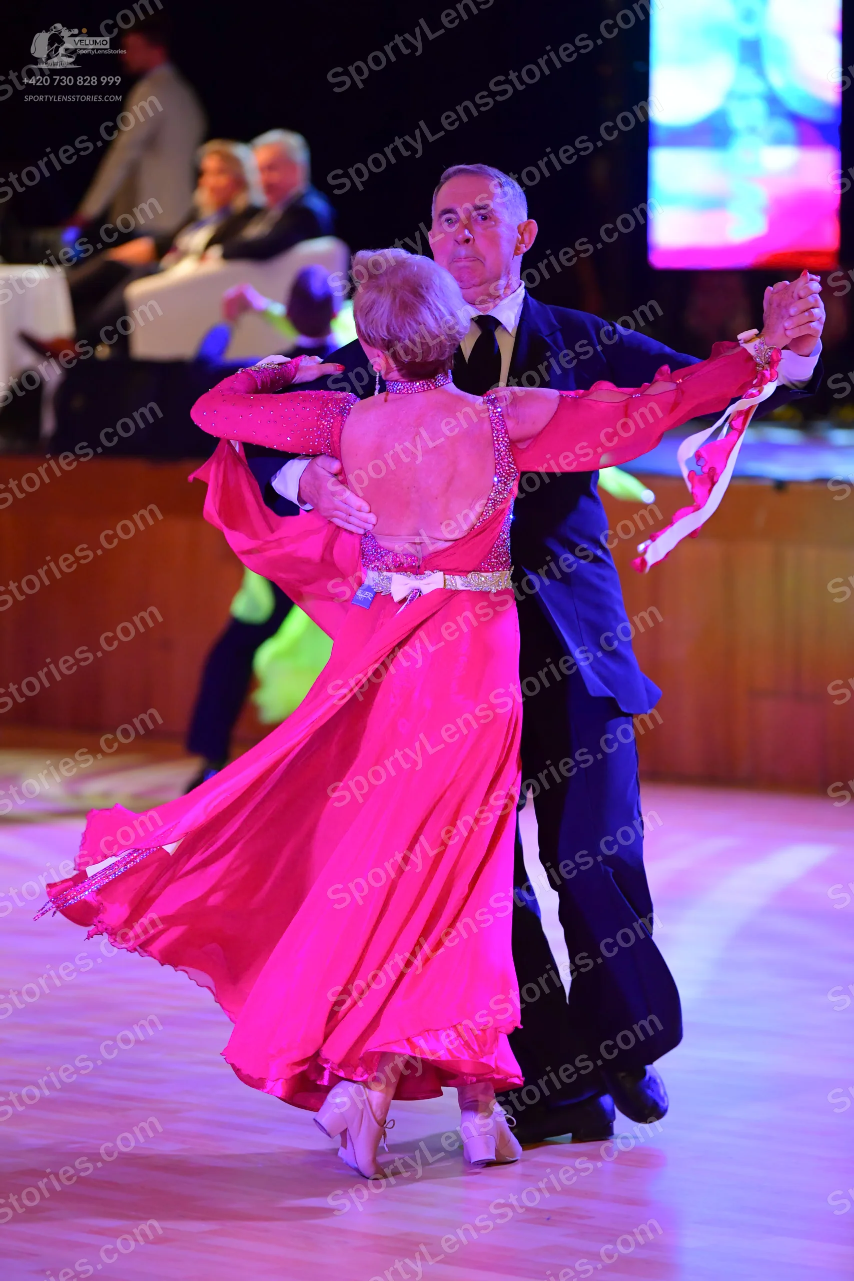 Dancesport competitor: Male:** Black tail suit with a subtle sequin embellishment on the lapels