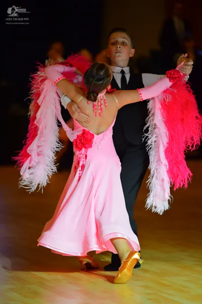 Dancesport competitor: Male dancer: black suit with a white shirt and black necktie
