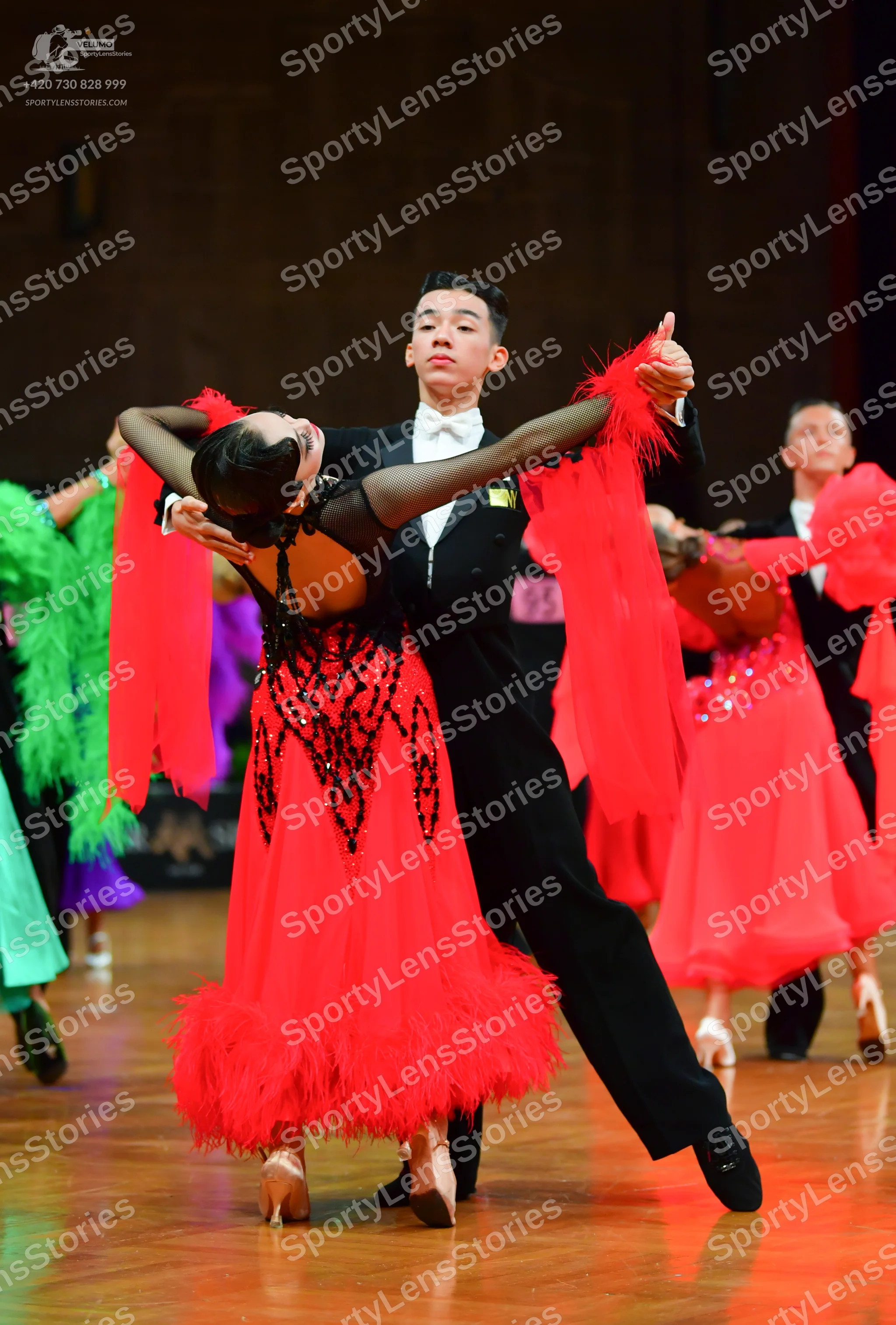 Dancesport competitor: Male dancer: black suit with a white shirt and white bowtie