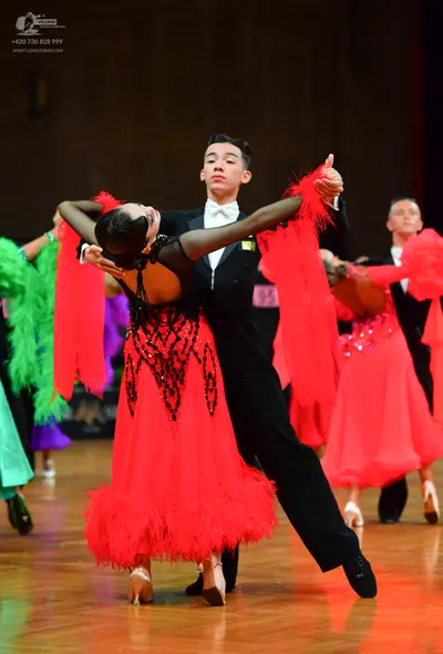Dancesport competitor: Male dancer: black suit with a white shirt and white bowtie