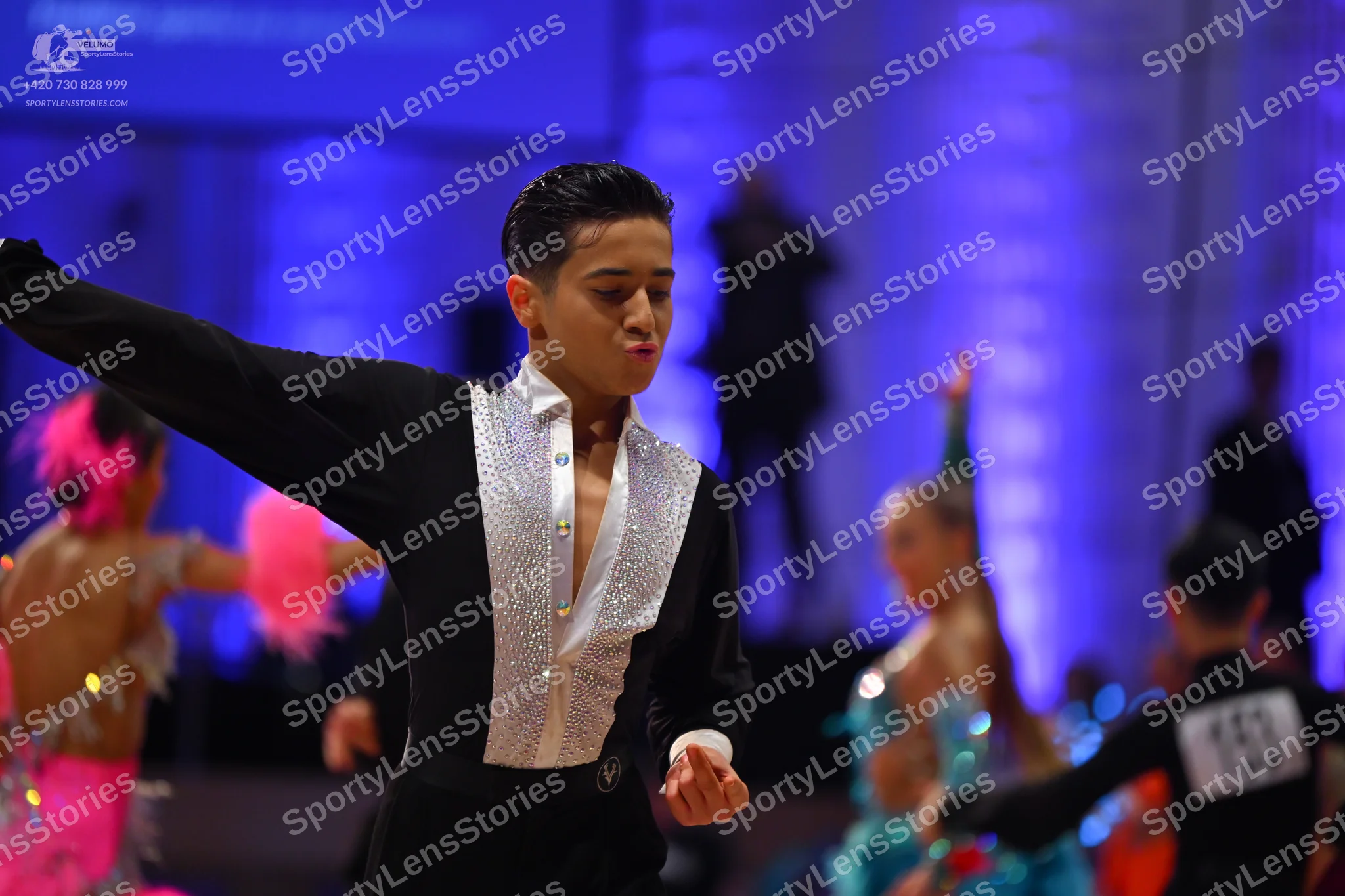 Dancesport competitor: Main male dancer: black Latin dance shirt with a white sequined front panel