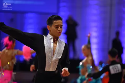 Dancesport competitor: Main male dancer: black Latin dance shirt with a white sequined front panel