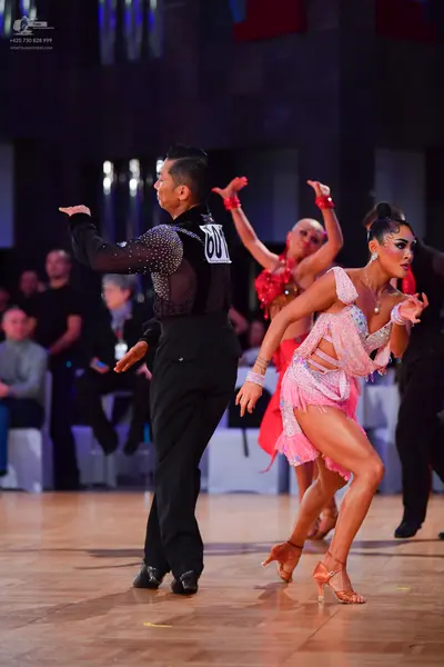 Dancesport competitor #60: Male dancer: black long-sleeved Latin shirt with sequins on the shoulder, black 