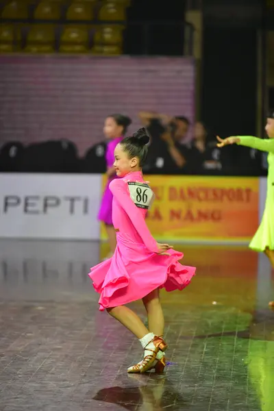 Dancesport competitor #86: Female dancer: bright pink latin dress