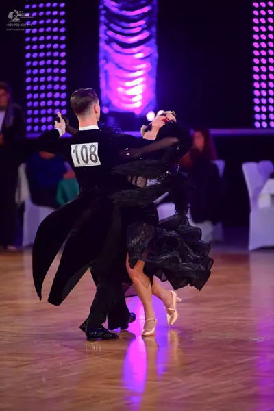 Dancesport competitor #108: Male dancer: black long-sleeved top and black trousers