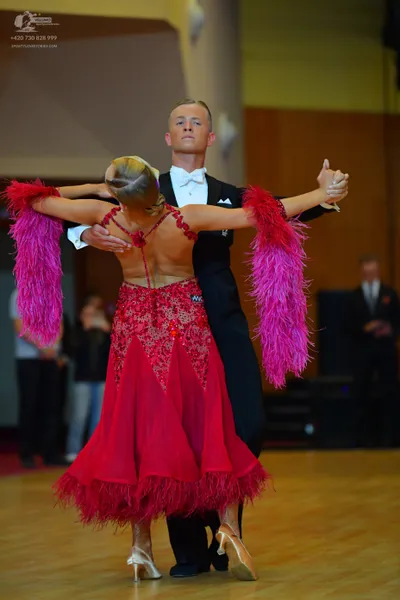 Dancesport competitor #39: Male dancer: black suit with a white shirt and white bow tie
