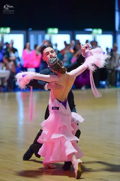 Dancesport competitor: Male dancer: black suit