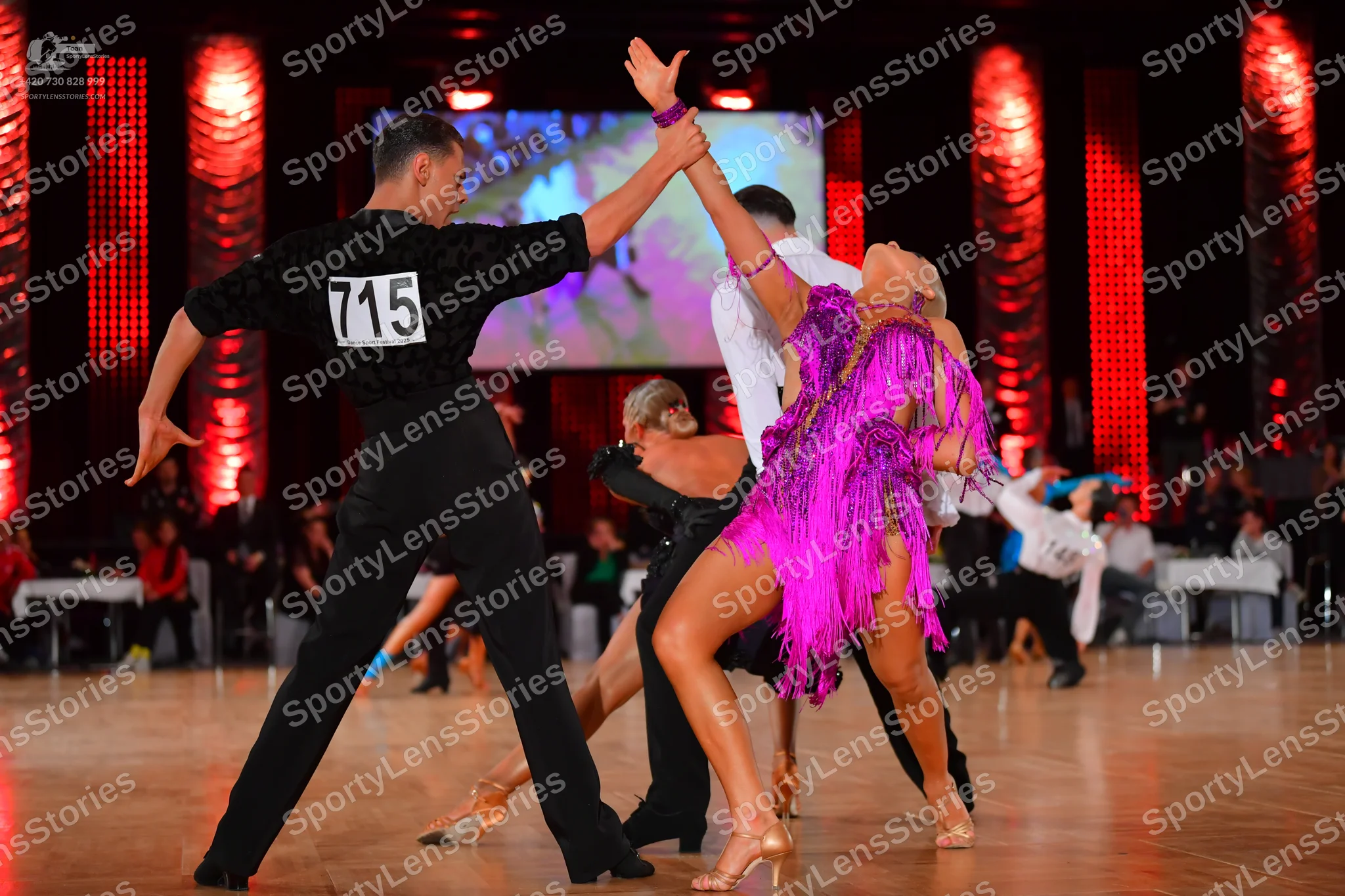 Dancesport competitor #715: Male dancer: black long-sleeved shirt and black trousers